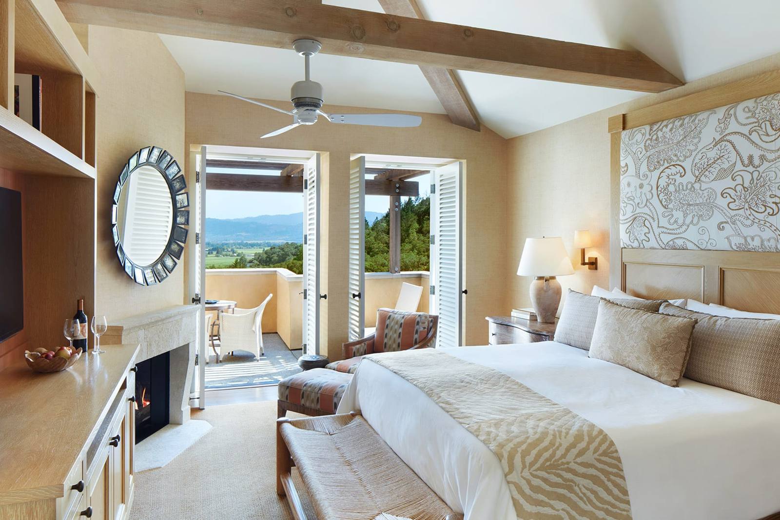 Guest room with fireplace and private terrace at Auberge du Soleil