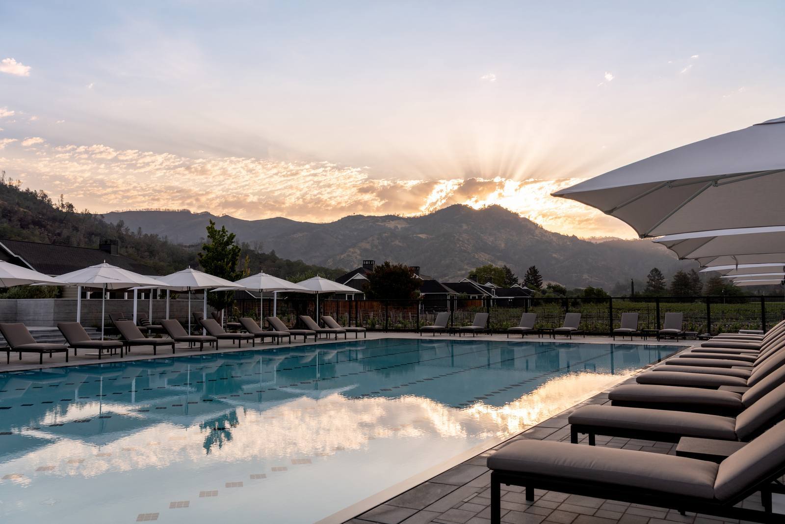 The pool terrace at Four Seasons Resort and Residences Napa Valley, with the Palisades behind