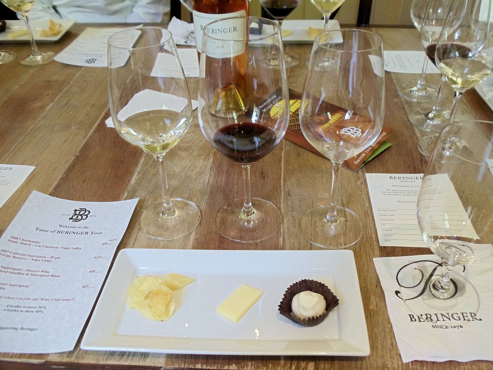 Wine glasses and a bottle on a tasting table at Beringer Vineyards