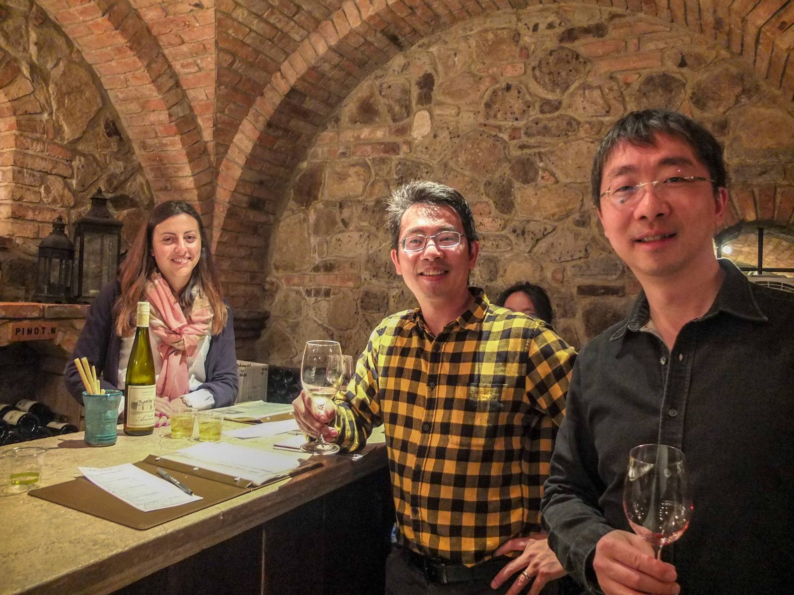 Visitors tasting wine in the barrel room at Castello di Amorosa