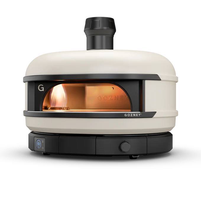 Gozney Dome S1 propane pizza oven with the rolling flame visible through the oven mouth