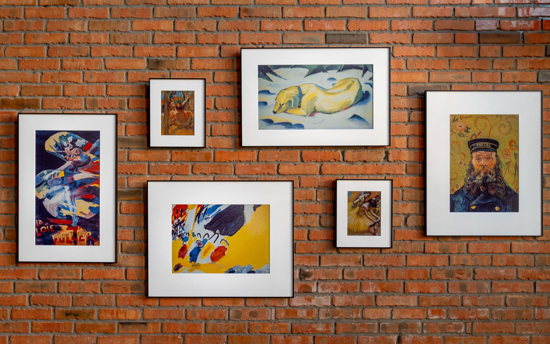 inkposter color ePaper art frames arranged as a gallery wall